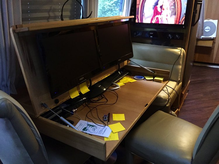 Mary’s husband works from “home” and they are full-timers, so he came up with this smart dinette conversion to house two monitors.
